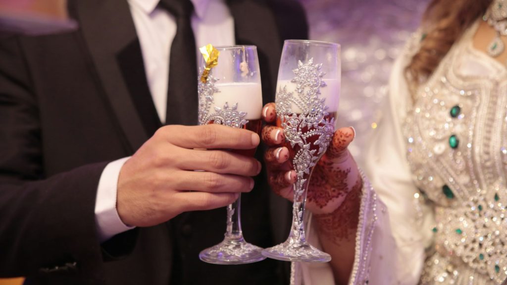 a man and a woman holding champagne flutes