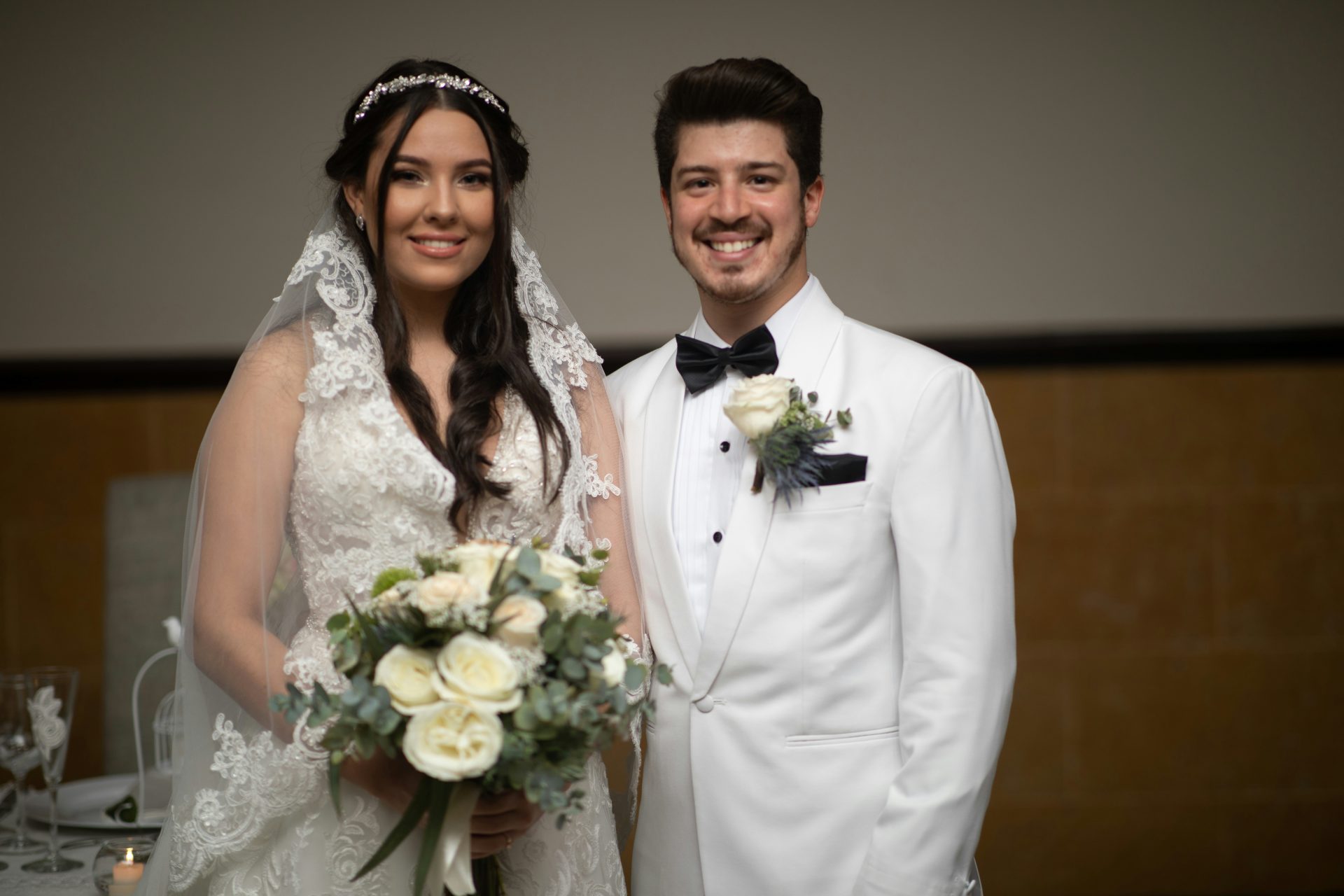 a bride and groom posing for a picture